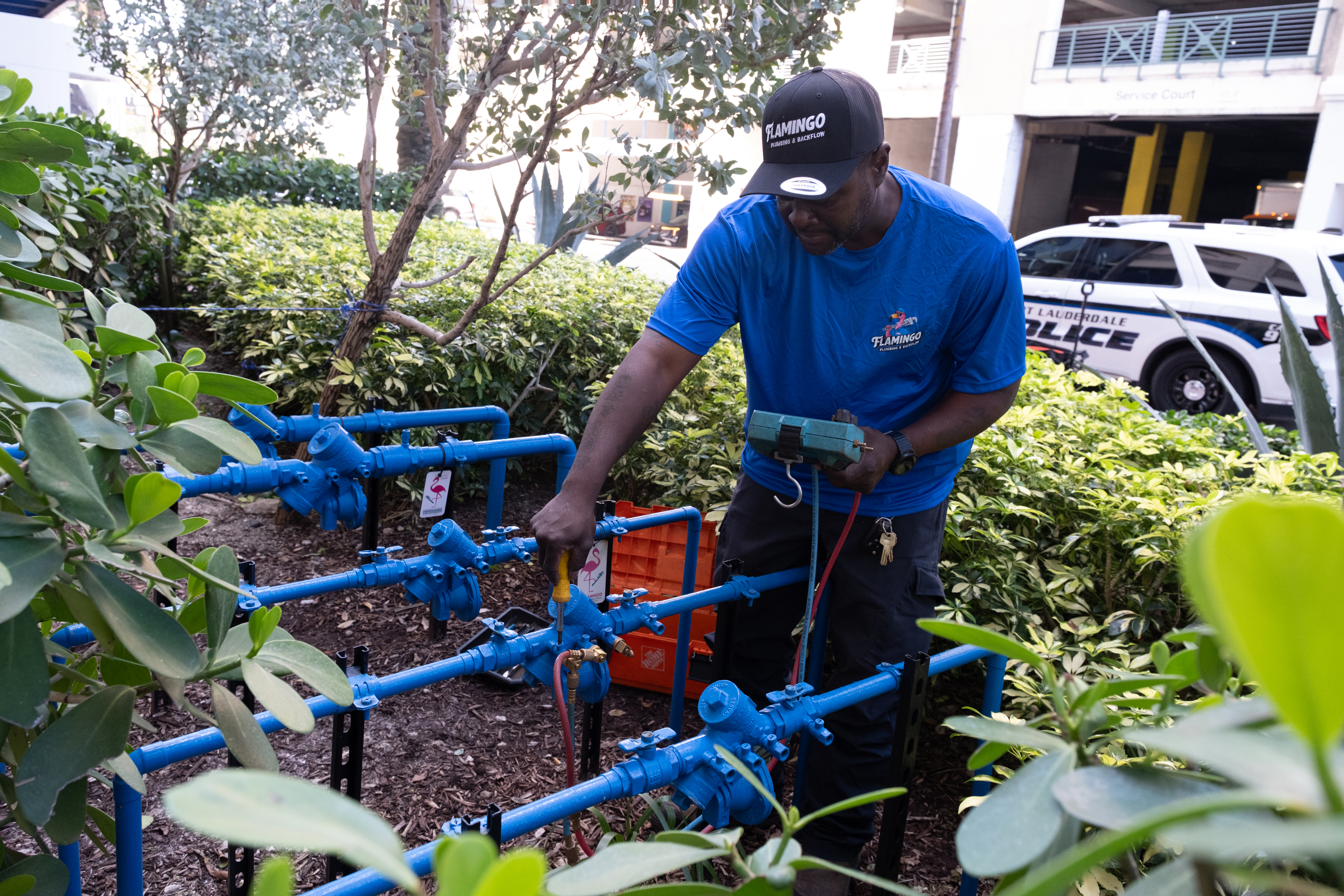 Flamingo technician servicing commercial backflow equipment