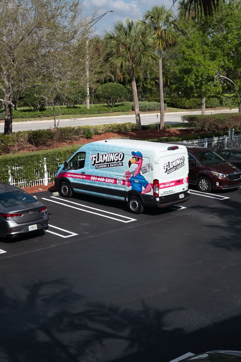 A Flamingo Plumbing service truck from above