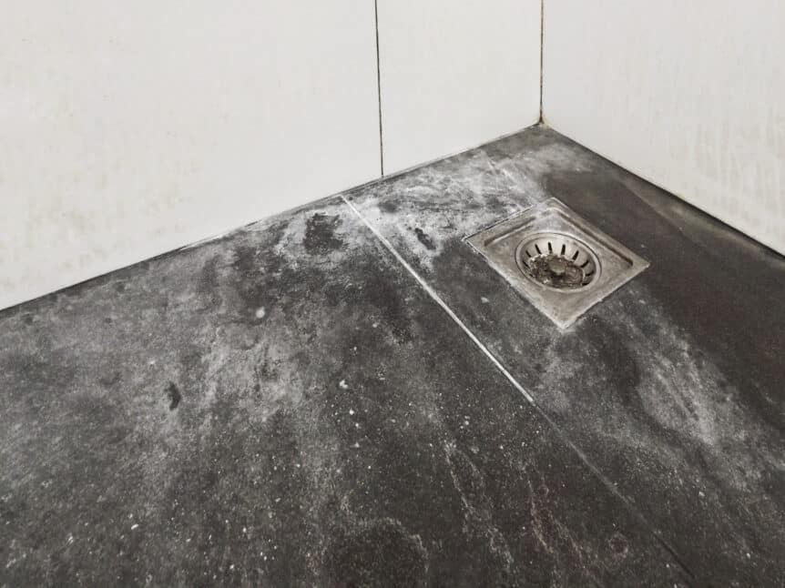 soap scum on shower floor with drain